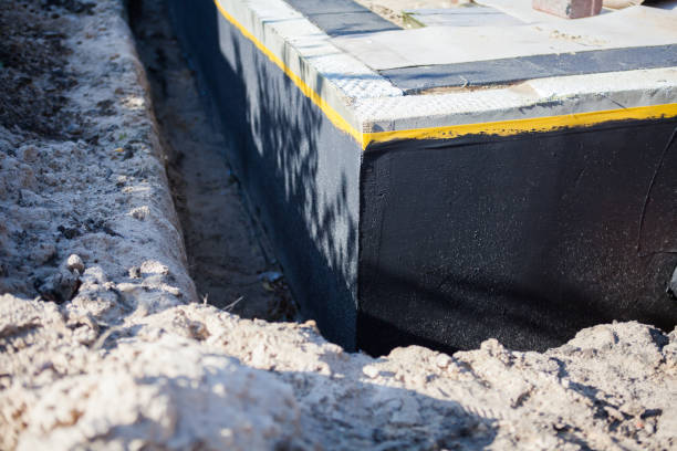 Professional Waterproofing technician working in Brownsville, OH